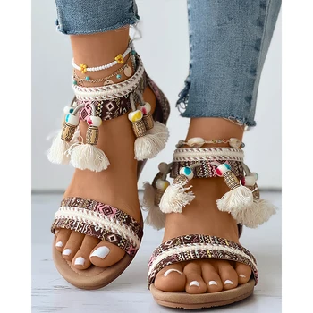  Летние женские модные повседневные туфли на плоской подошве с кисточками в племенном стиле, расшитые бисером пляжные сандалии в стиле бохо с ремешком на щиколотке